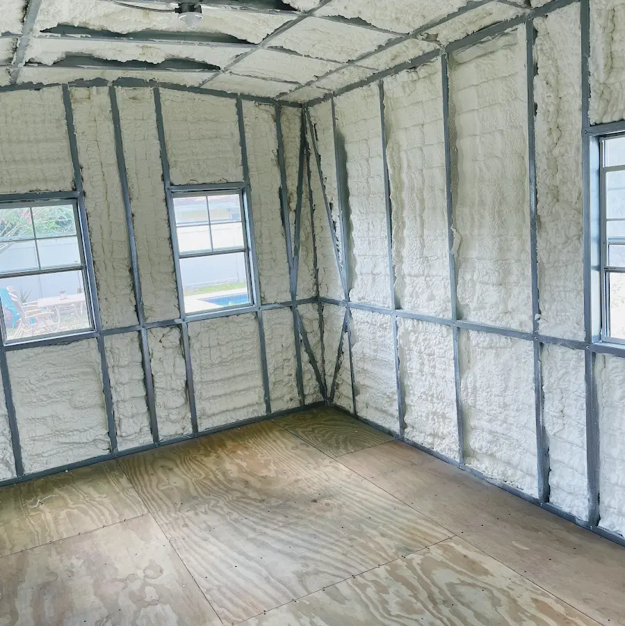 Closed-cell spray foam insulation applied to wall cavities in a residential project in Des Peres